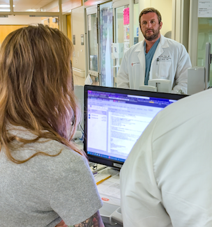 Thumbnail image of doctor with clinical team member.