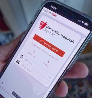 Thumbnail image of cellphone with UH MyChart login screen.
