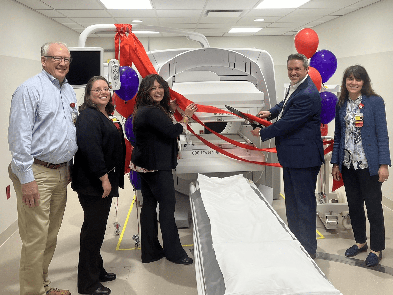 UH Caregivers pose in front of SPECT CT
