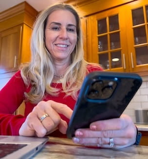 Thumbnail of a woman using her cellphone for a telehealth visit.