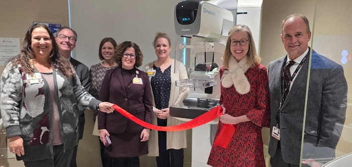 UH TriPoint employees at a ribbon cutting ceremony.