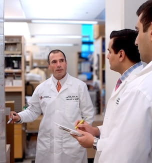 Thumbnail image of Dr. Jordan Winter with researchers in lab.