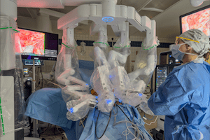 Image of robot in surgery with nurse watching.